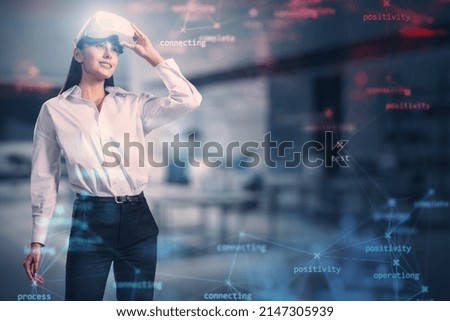 Attractive young european businesswoman with VR glasses and creative process stages mesh on blurry office interior background with mock up place. Process, metaverse, system and software testing 