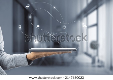 Close up of woman hand holding smartphone with abstract SEO and communication hologram on blurry office interior background. Double exposure