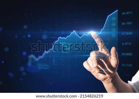 Stock market profit increase concept with man finger touching virtual screen with growing financial market graph