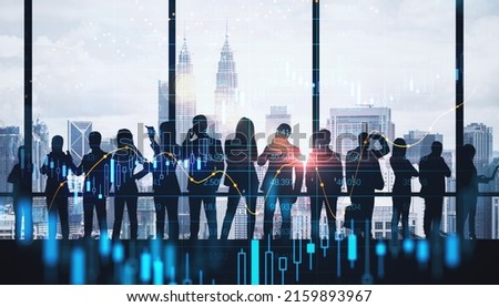 Management strategy and financial planning concept with dark silhouette of group of people looking at city skyscrapers through transparent wall and digital graphs and stock market candlestick