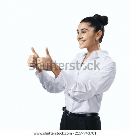 Like concept with happy young woman in white shirt holding thumbs up on white background, close up, isolated