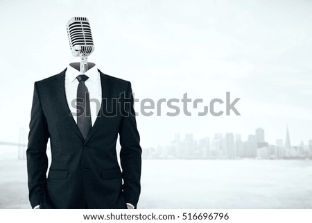 Mic headed businessman on city background with copy space. Voice concept