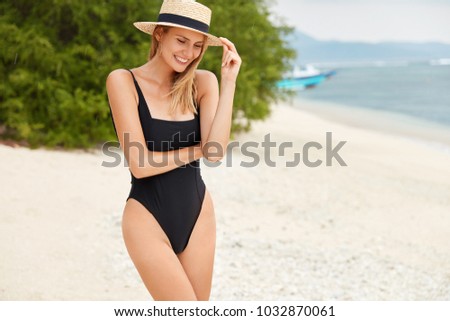 Image, Stock Photo Slender woman in swimsuit relaxing at poolside