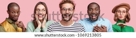 Portrait of diverse mixed race people being in good mood, have broad smiles, isolated over pink background. Attractive female in beret blows air kiss, amazed dark skinned male and happy Asian woman