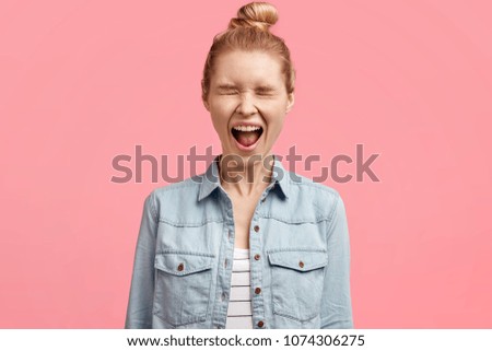 Similar – Image, Stock Photo Blonde woman wearing denim shirt and black leather skirt sitting in an urban bench.