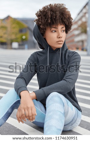 Similar – Image, Stock Photo Tired sportswoman with basketball ball resting on court