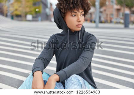 Similar – Image, Stock Photo Focused stylish black woman applying eyeliner at home