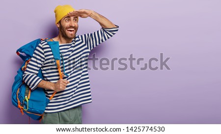 Similar – Image, Stock Photo Pleased tourist with backpack taking selfie on smartphone sitting on bridge above mountain river