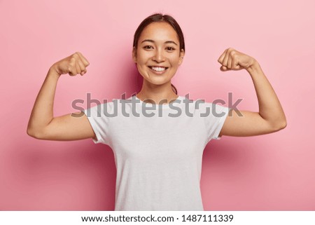 Similar – Image, Stock Photo Glad woman showing photo gesture near wall outdoors