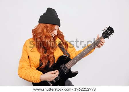 Similar – Image, Stock Photo Positive woman playing guitar in bedroom