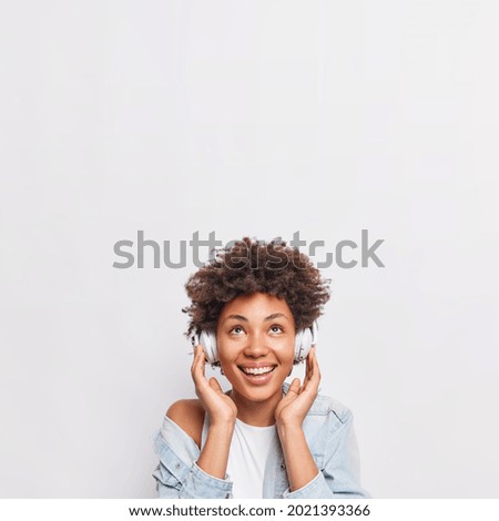 Similar – Image, Stock Photo Dreamy black woman listening to music in headphones