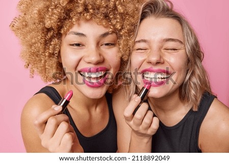 Similar – Image, Stock Photo Woman applying lipstick and looking in side mirror of bus