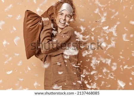 Similar – Image, Stock Photo Pillow fight girl dressed