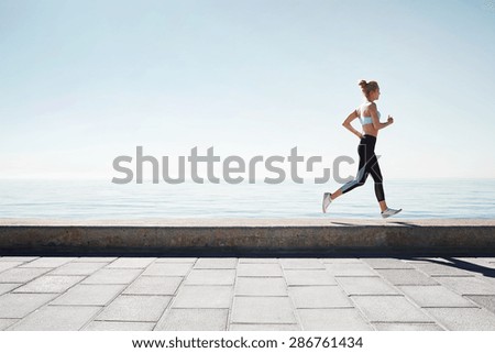 Running asian woman. Female runner training outdoors seaside athlete on beautiful sunset or morning at beach.