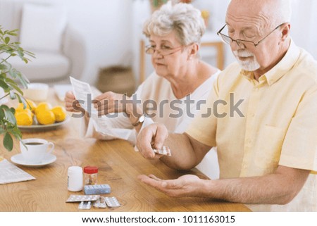 Similar – Image, Stock Photo Senior man taking prescription medicine at home