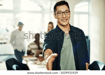 Similar – Image, Stock Photo Ethnic happy businessman shaking hands with partner and looking at camera