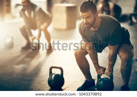 Similar – Image, Stock Photo Young athlete squatting with barbell