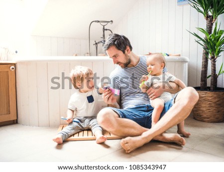 Similar – Image, Stock Photo Father with daughter barefoot on grass