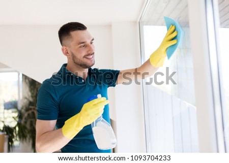 Similar – Image, Stock Photo Man washing window in yellow rubber gloves