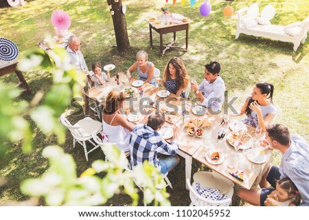 Similar – Image, Stock Photo A happy garden party with floating chair