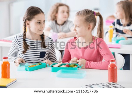 Similar – Image, Stock Photo Boy sits in front of green wall and grins