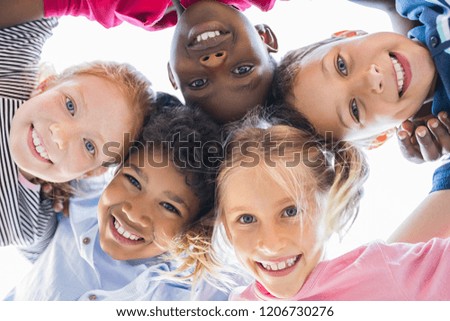 Similar – Image, Stock Photo Ethnic child playing with toy windmill in field