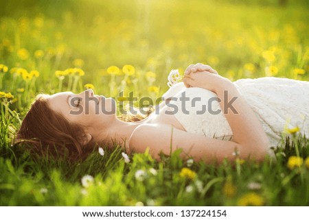 Similar – Image, Stock Photo Lying smiling woman with petals on face