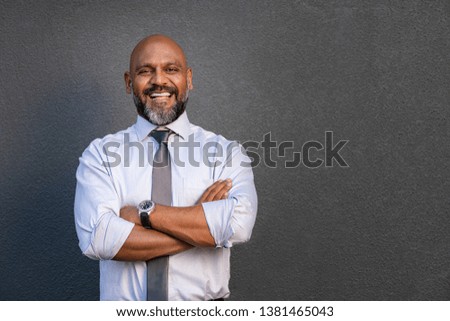 Similar – Image, Stock Photo Successful mature businessman in glasses typing on laptop at his workplace