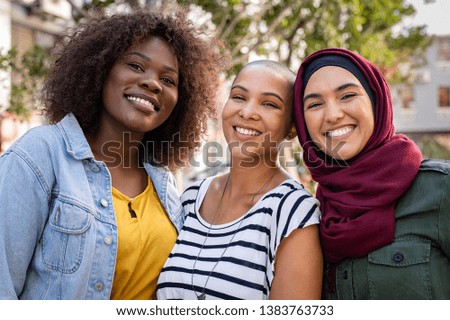 Similar – Image, Stock Photo African arab young girl between green leaves smiling. Pointing Copy space for text and adds. Trendy clothes, Jeans and white tshirt modern styling. Social networks