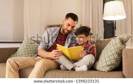 Similar – Image, Stock Photo Father and son reading book together