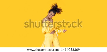 Similar – Image, Stock Photo Playful trendy young ethnic woman in deserted countryside