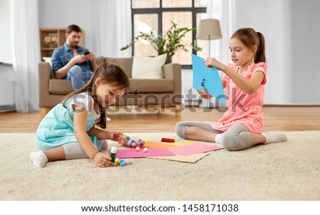 Similar – Image, Stock Photo Two beautiful sisters do their homework during quarantine. Children use gadgets for learning. Education, distance learning, home schooling during quarantine