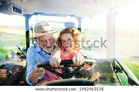 Similar – Image, Stock Photo Female farmer with tractor on olive plantation