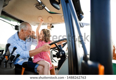 Similar – Image, Stock Photo Female farmer with tractor on olive plantation