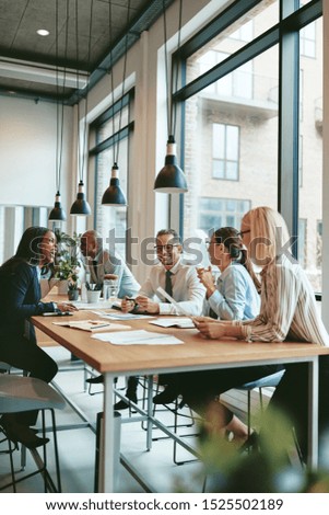 Similar – Image, Stock Photo Business people  in work meeting seen through the glass