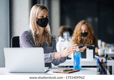 Similar – Image, Stock Photo Woman in mask working on laptop