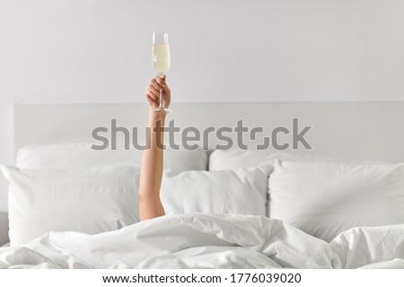 Similar – Image, Stock Photo Anonymous young woman drinking coffee in bed
