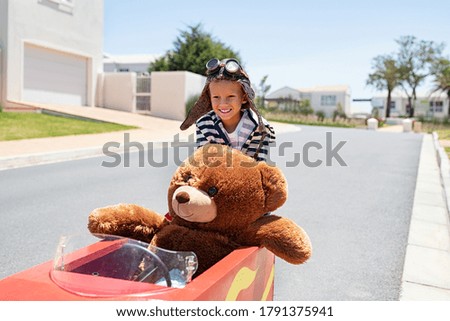 Similar – Image, Stock Photo Little kid riding his bike down