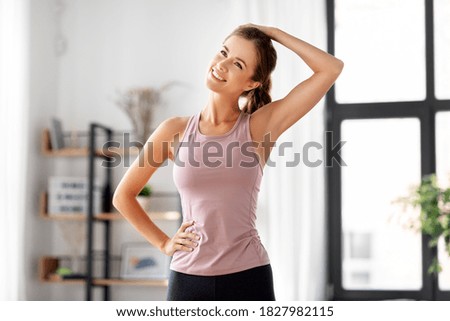 Similar – Image, Stock Photo Young woman stretching and breathing fresh air in middle of forest while exercising