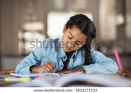 Similar – Image, Stock Photo Little hispanic girl studying in front of the laptop. E-learning, study at home online.