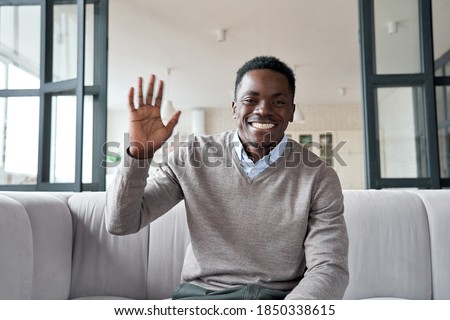 Similar – Image, Stock Photo Elegant black man talking smartphone leaning building