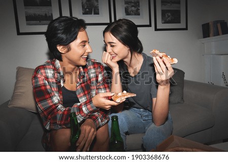 Similar – Image, Stock Photo A cool couple chatting in a beach in the sunset time