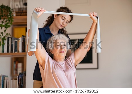 Similar – Image, Stock Photo Woman helping senior woman dress in her bedroom