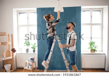 Similar – Image, Stock Photo Cheerful woman painting in workshop