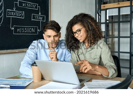 Similar – Image, Stock Photo Concentrated adult worker using dolly cart working in warehouse