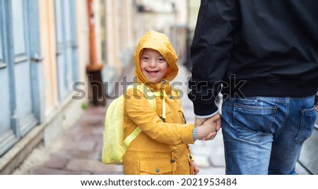 Similar – Image, Stock Photo Boy with special needs water color painting with both hands at the same time; AAC communication device sits nearby