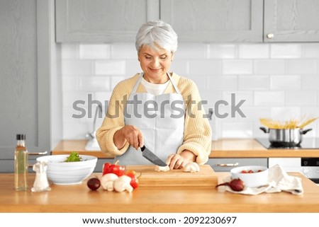 Image, Stock Photo Senior woman preparing mushrooms