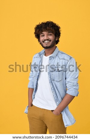 Similar – Image, Stock Photo Portrait of young arab woman wearing white shirt and blue jeans smiling to camera on a brick wall with graffiti painting background. Street life style, cool trendy. Social network concept