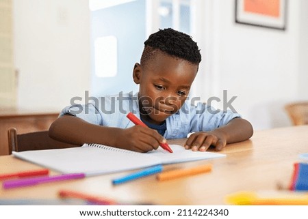 Similar – Image, Stock Photo Child doing homework