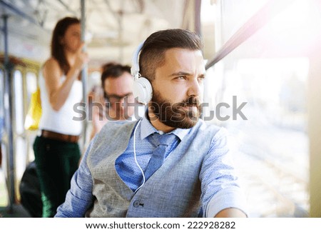 Similar – Image, Stock Photo Bearded man listening to music in headphones